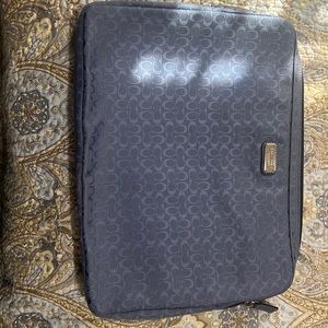 Coach laptop sleeve. Used condition. Would fit a standard laptop under 15”